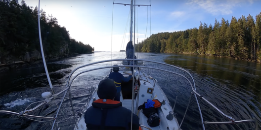 A sailor and a child navigate Dodds Narrows on a beautiful sunny day.