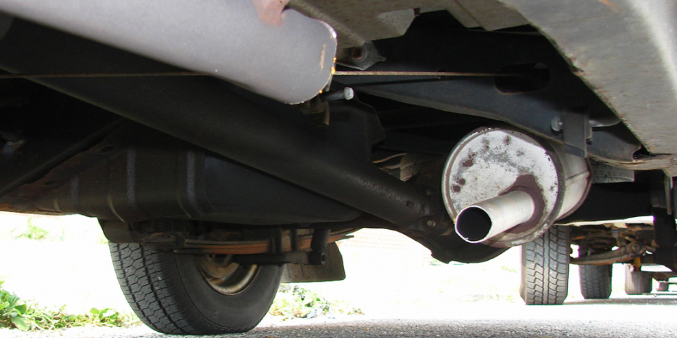 The underside of a car. The catalytic converter is missing because, as the photographer put it, "some dickheads stole it."