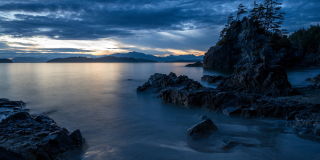 Cloudy Bamfield coast sunrise with islands on horizon